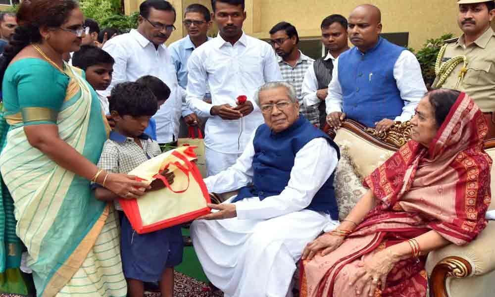 Governor celebrates birthday with poor children in Vijayawada