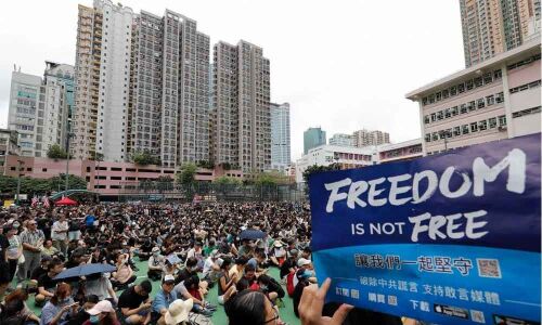 Hong Kong protesters throw Chinese flag into iconic harbour