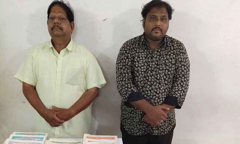 Two held for making fake land documents