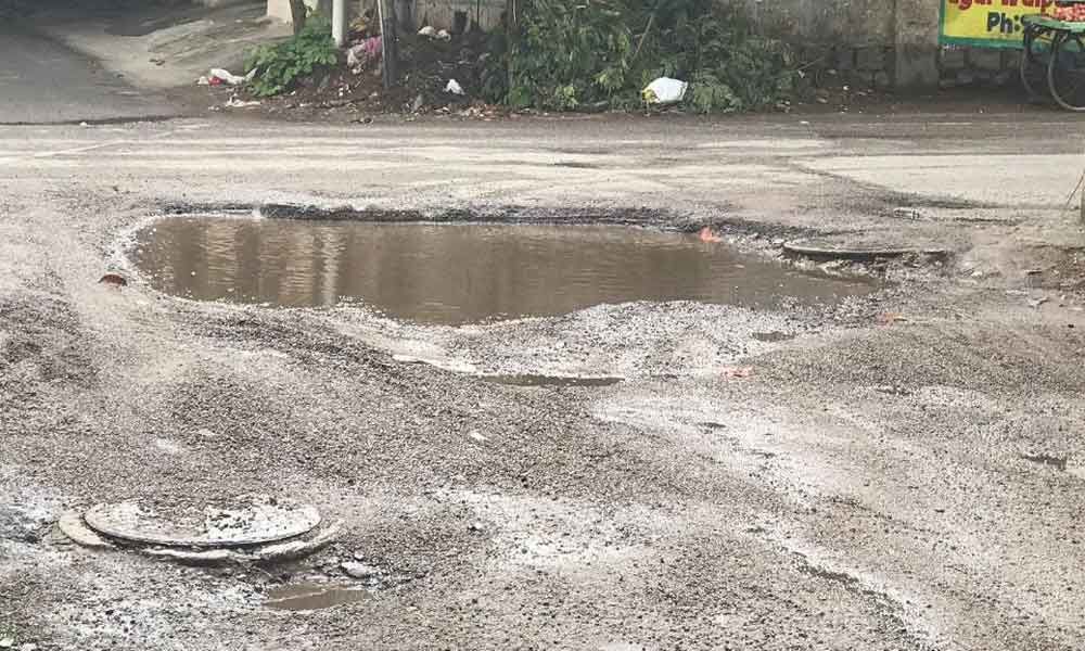 Motorists fume over potholes-filled road