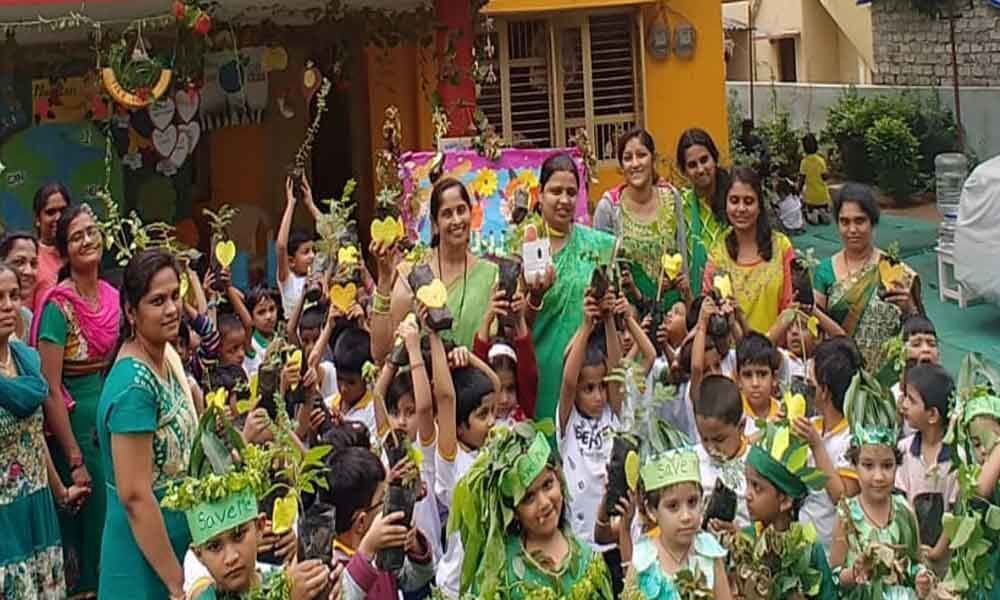Corporator Bobba Navatha Reddy distributes saplings to students
