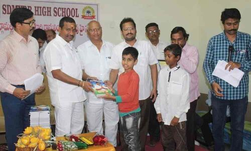 Minister Vellampalli Srinivas distributes books in Vijayawada