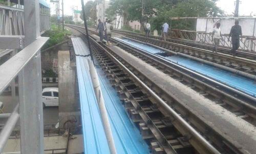 Tin sheets fixed to stop filth falling on motorists
