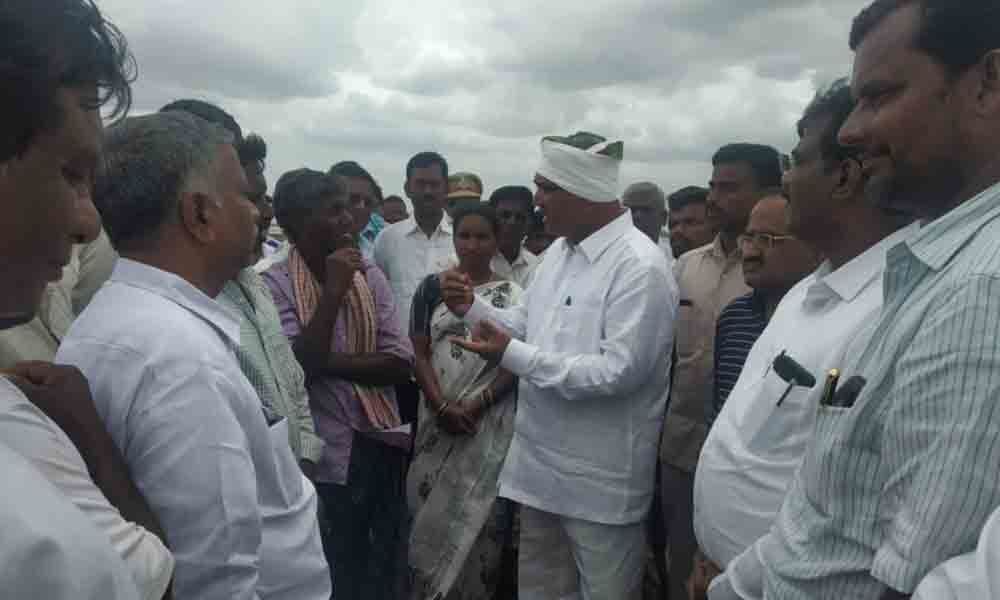 Agriculture Minister Singireddy Niranjan Reddy visits flood-affected villages, assures help
