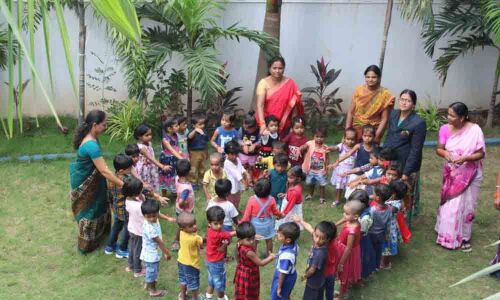 Children tie rakhis to each other in Karimnagar