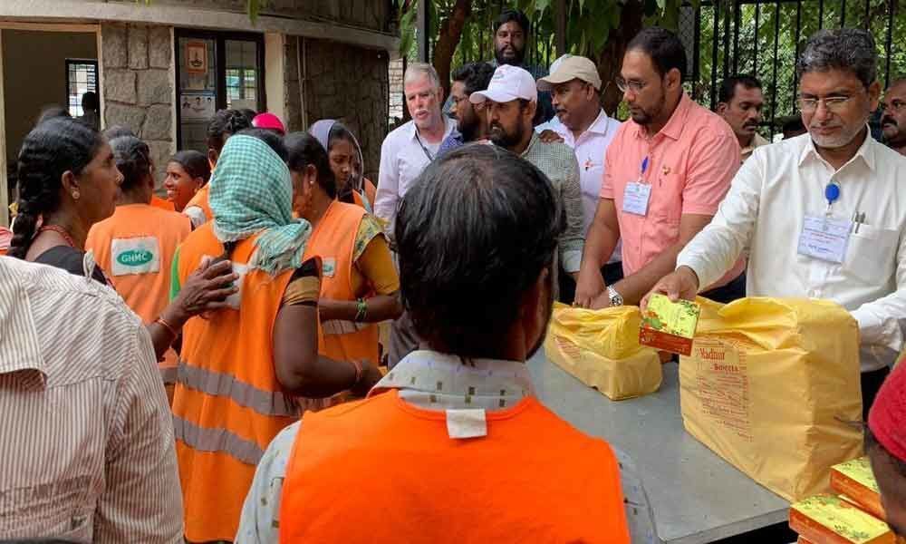 Locals distribute sweets to GHMC workers
