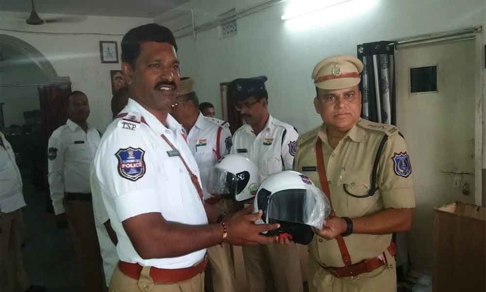 Helmets distributed to traffic cops