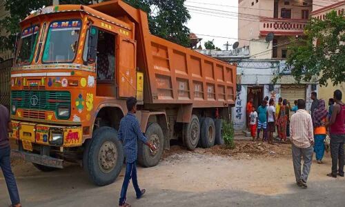 Truck rams into house; family escapes unhurt
