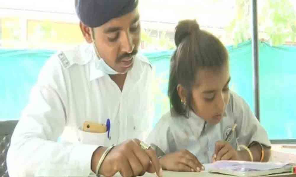 Traffic cops run education centres for children living on footpath