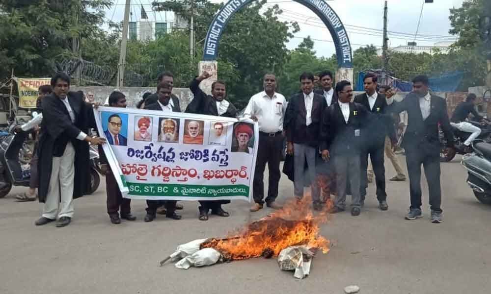 Lawyers hold protest, burn RSS chiefs effigy