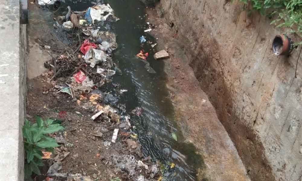 Clogged open drain keeps locals on edge