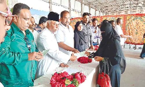 MLA Syed Ahmed Pasha Quadri distributes Shaadi Mubarak cheques