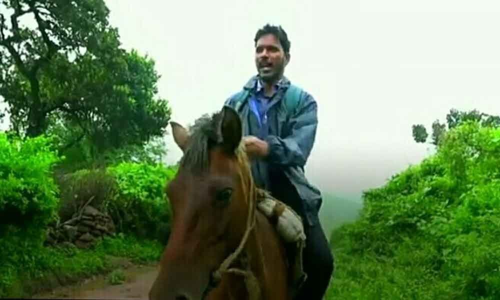 Teacher rides horse to trek tough paths to reach school
