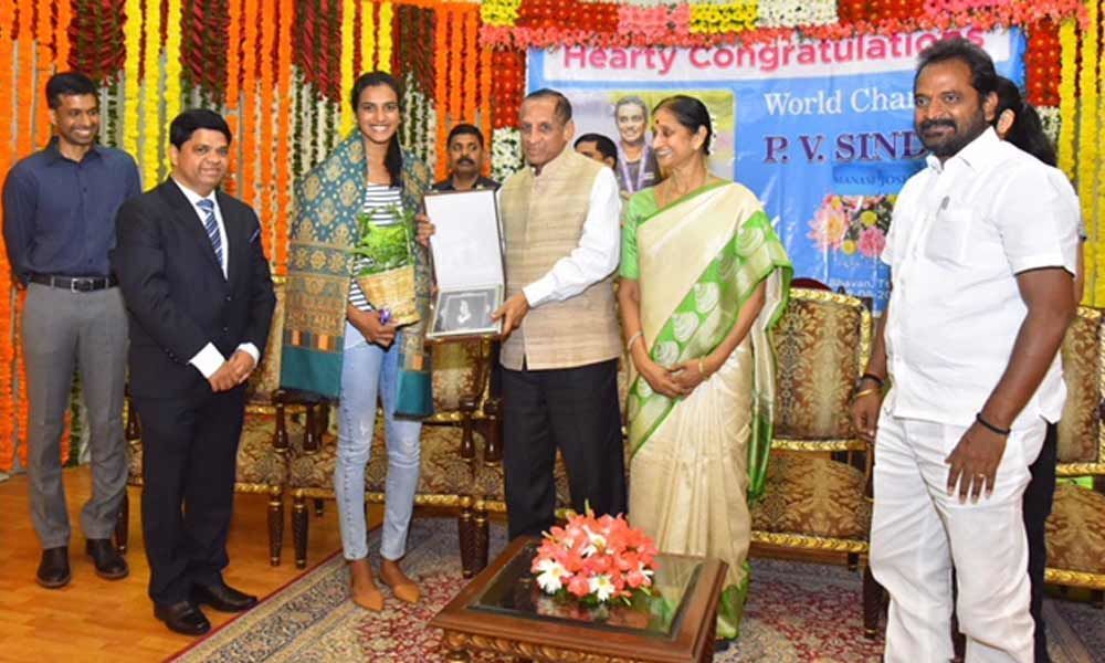 Telangana Governor felicitates PV Sindhu