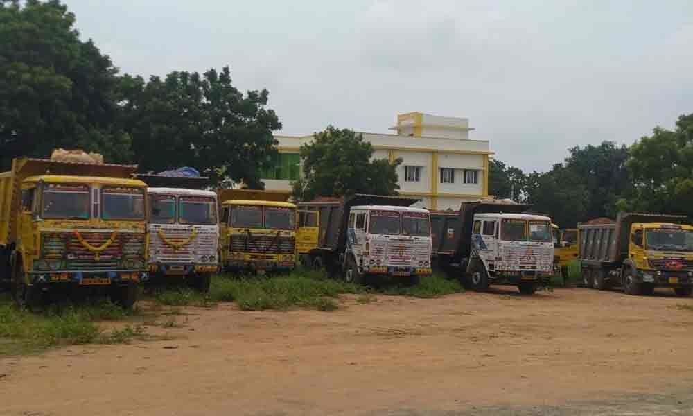 12 trucks ferrying illegally mined red gravel seized