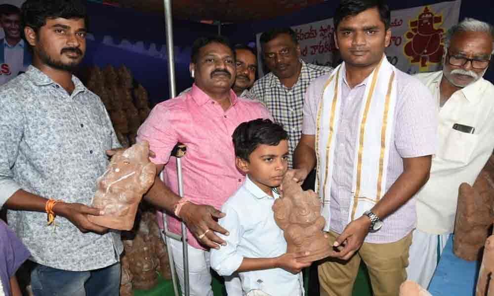 Collector distributes clay Ganesh idols  in Chittoor