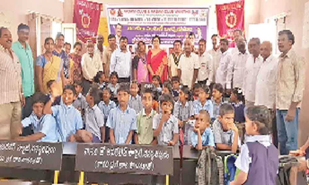 Vasavi Clubs donate benches to govt school