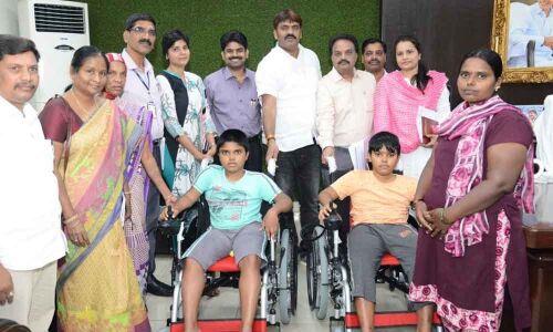 Mayor, wife present wheel-chairs to boys