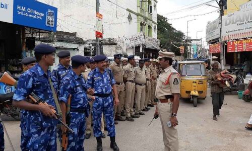 Cops hold flag march to instill confidence