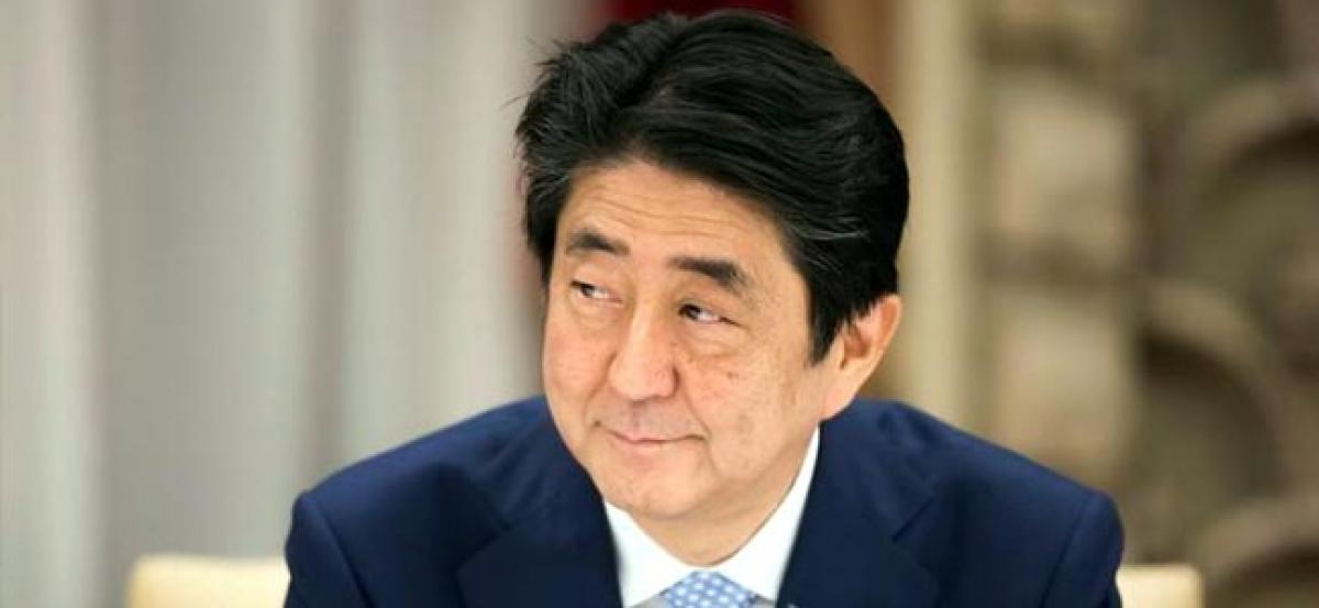 Japan PM Abe battles scandal on two fronts as questions swirl