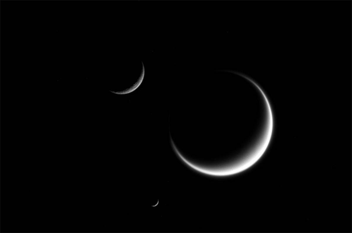 Rare triple crescent moons of Saturn captured