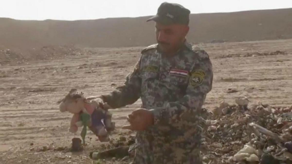 Iraqi investigators probing a mass grave found near IS-held Mosul