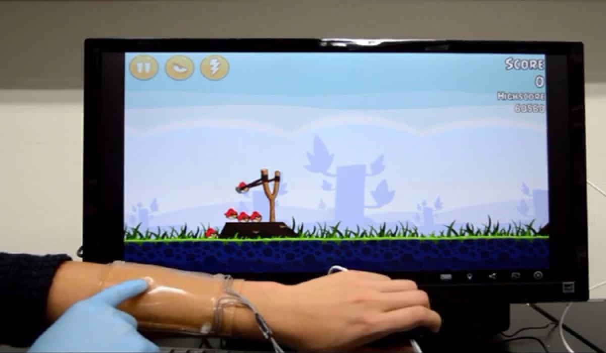 Wearable touch pad can be used to write and play games 