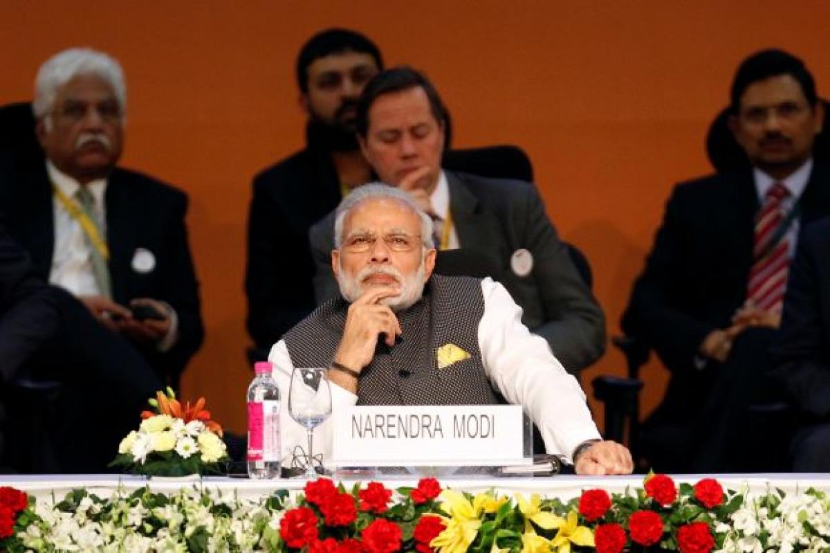 On eve of state polls, Modi looks to clean up campaign funding