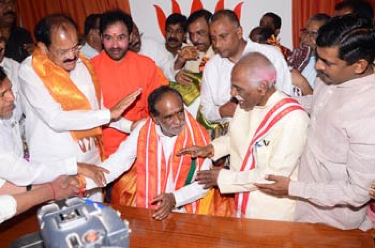 Laxman assumes charge as State BJP chief