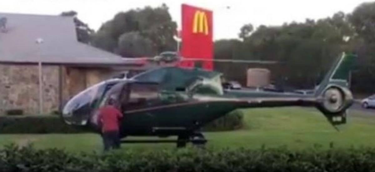 WATCH: Aus pilot lands chopper next to McDonalds to grab quick bite!