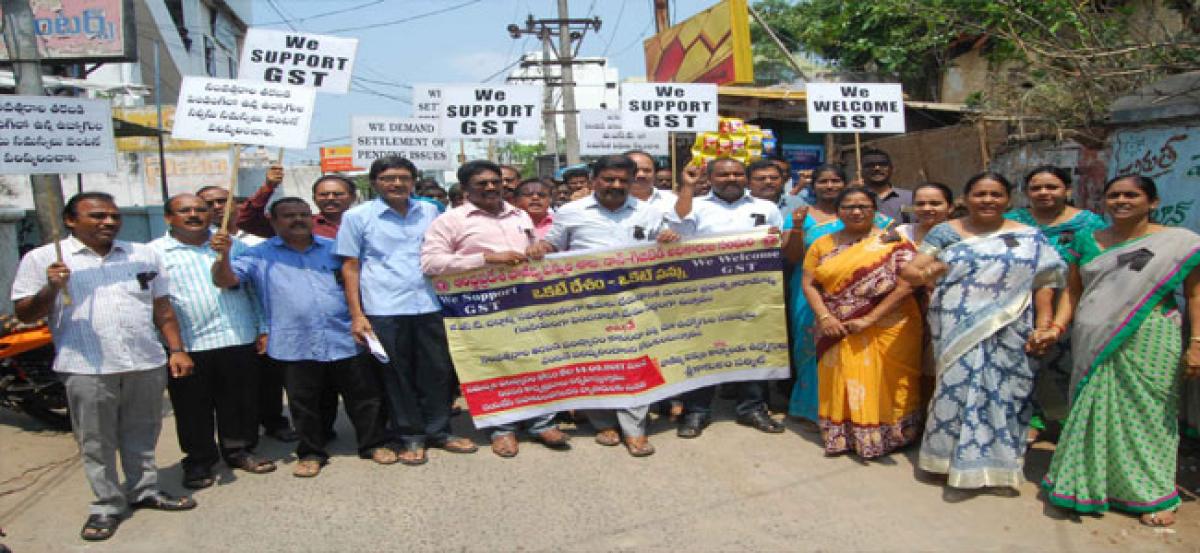 Commercial tax employees stage dharna