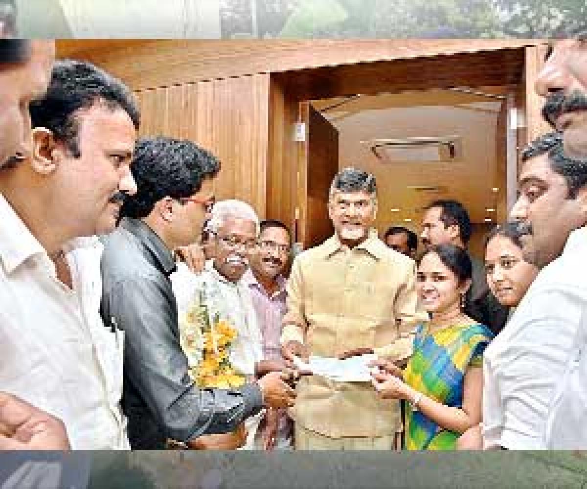 ZP chairperson hands over ` 2 lakh cheque to CM