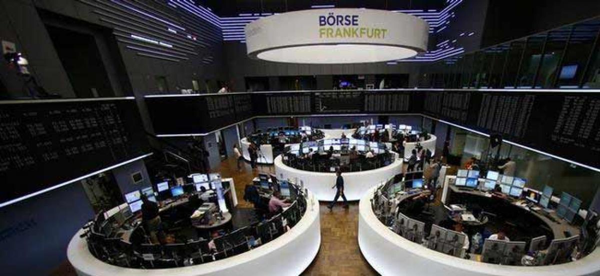 European shares slip from highs as Macron win seen priced in