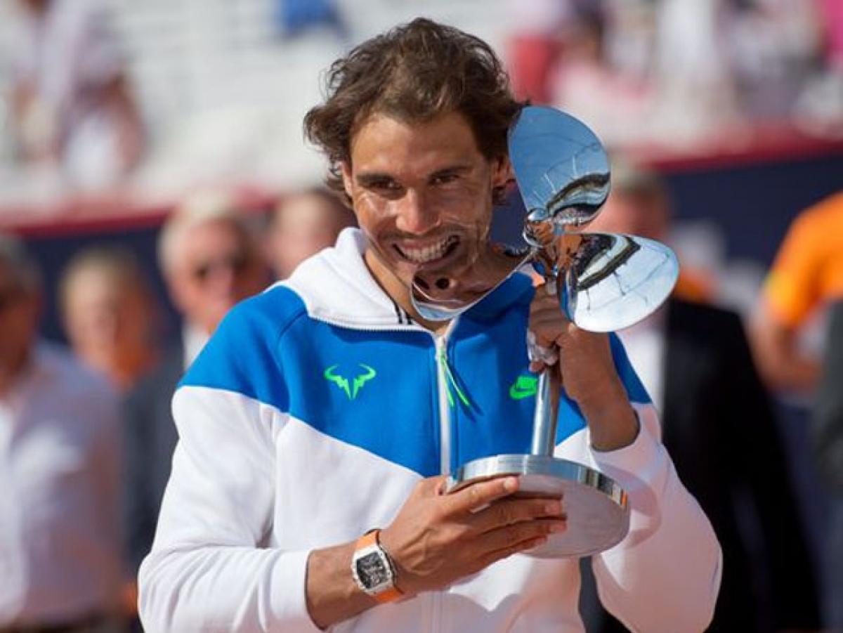 Spains Rafael Nadal beats Italys Fabio Fognini to win Hamburg Open