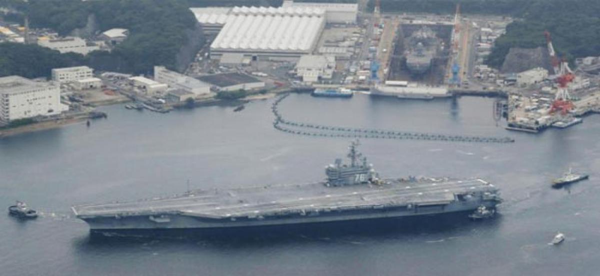 Japans military begins major drill with U.S. carriers watching North Korea
