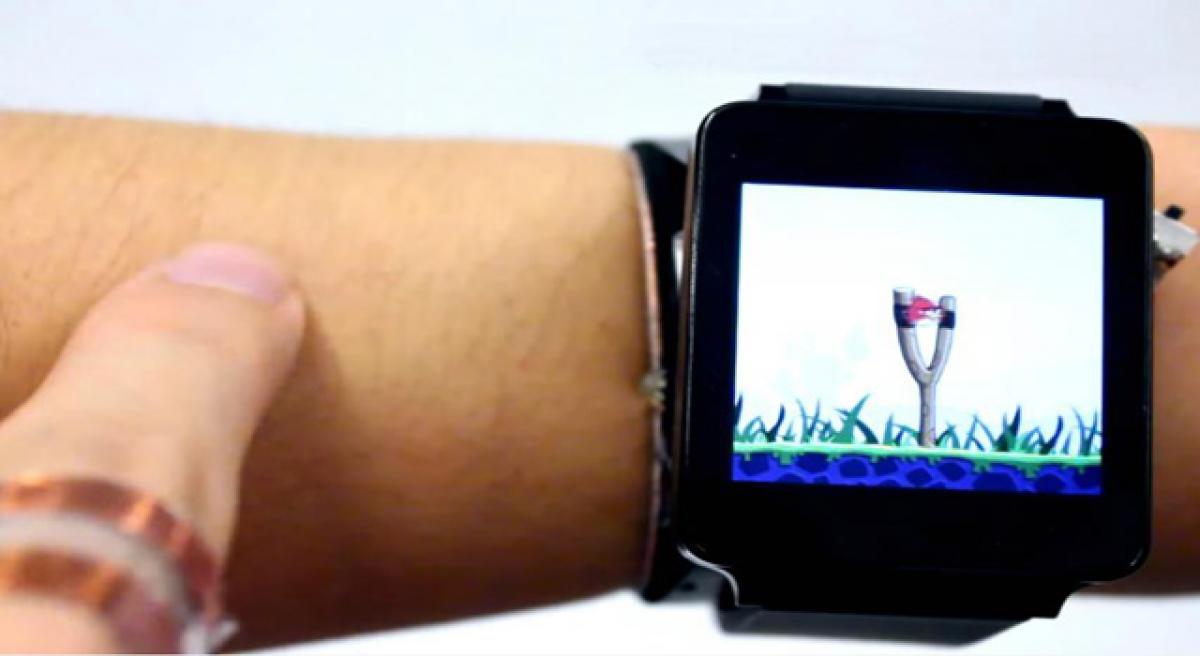 This wearable touch pad can help write, play games