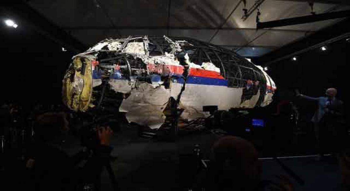 Six families of MH17 crew sue airline