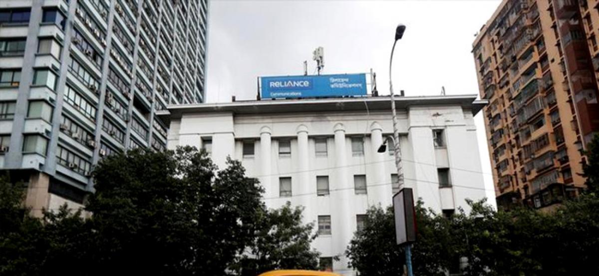 Reliance Communications shares, bonds plunge as losses, debt woes mount