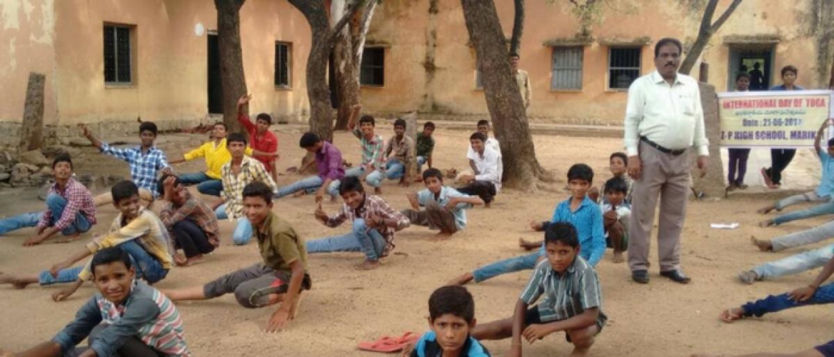 Govt teacher campaigns for Yoga among students
