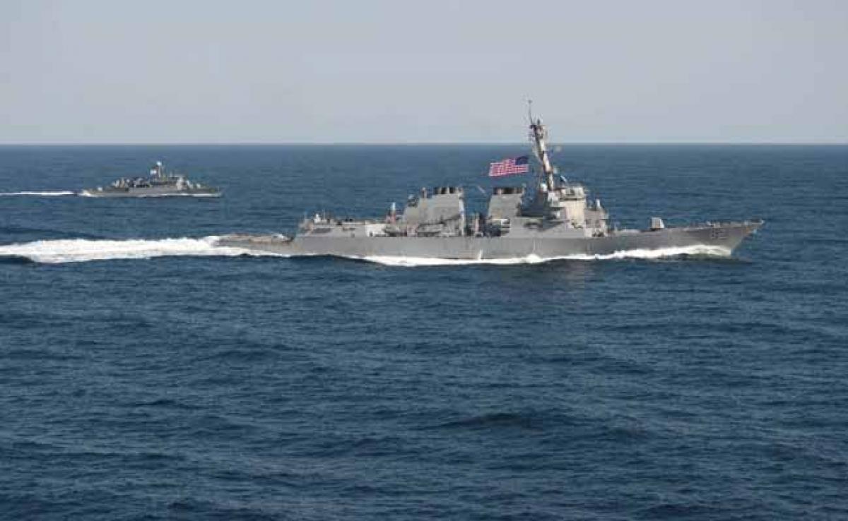 US sailing warship in South China Sea provocative and illegal says China