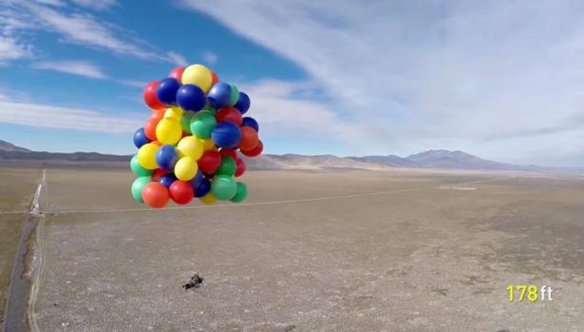 Man takes to the skies with bunch of balloons tied to chair