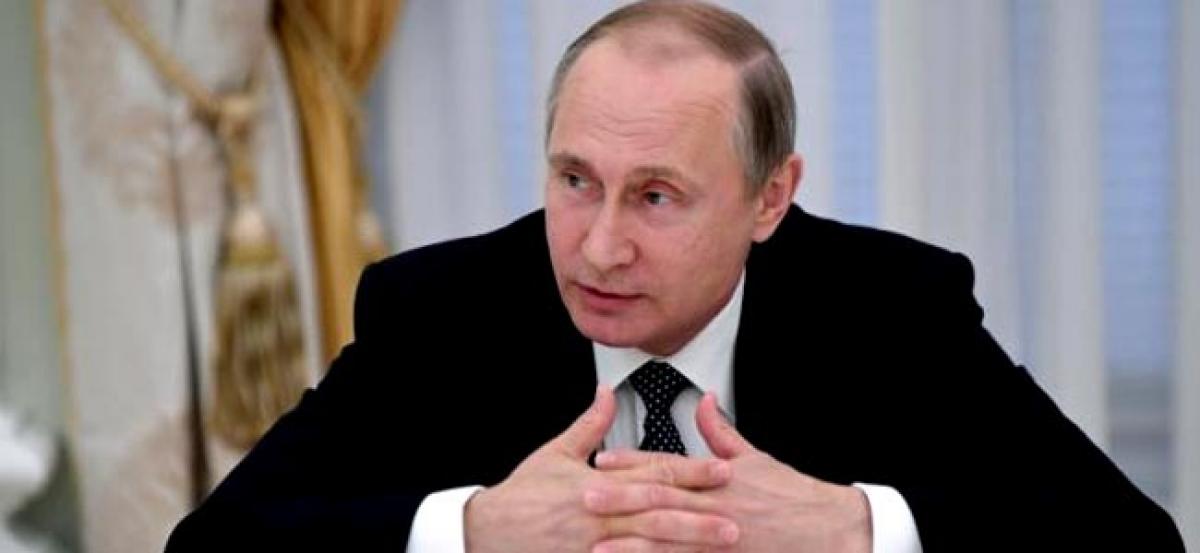 Putin will meet Russias Olympic team on wednesday