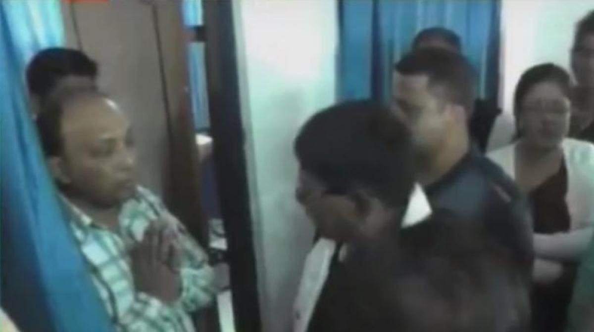 Engineer made to apologize in Assam by touching the feet of a BJP MLA