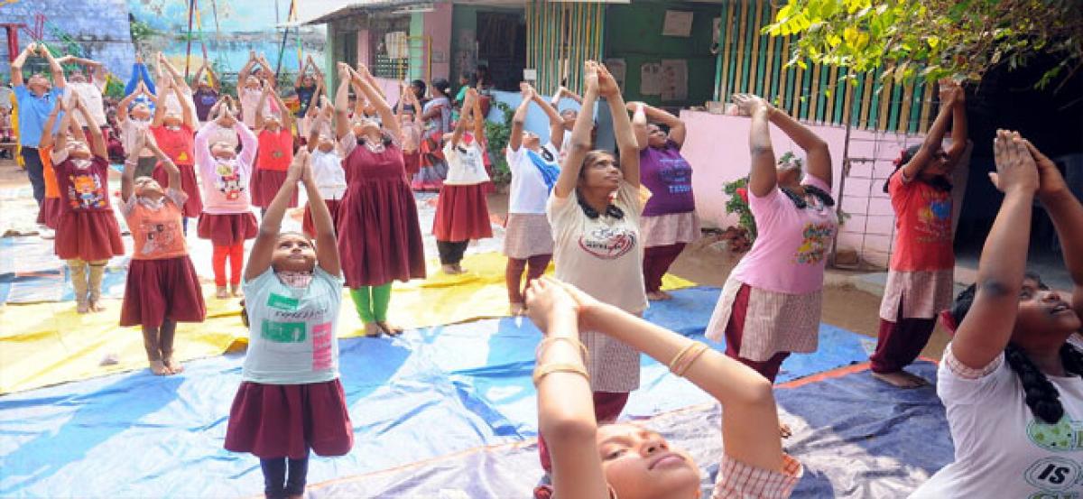 Students mark Radha Saptami with Surya Namaskaram