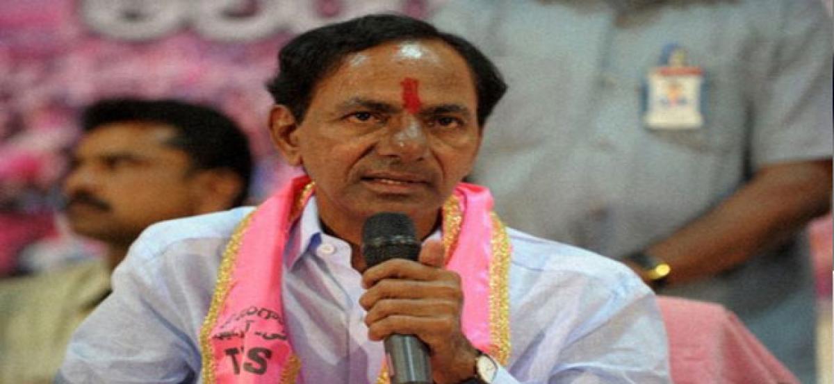 Chief Minister K Chandrashekar Rao presents medals to police officers