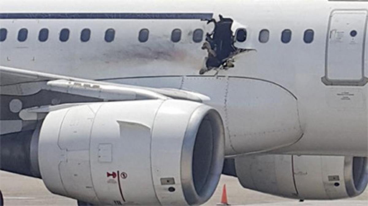 Man killed in explosion on an Airbus A321 that made a hole in the fuselage 