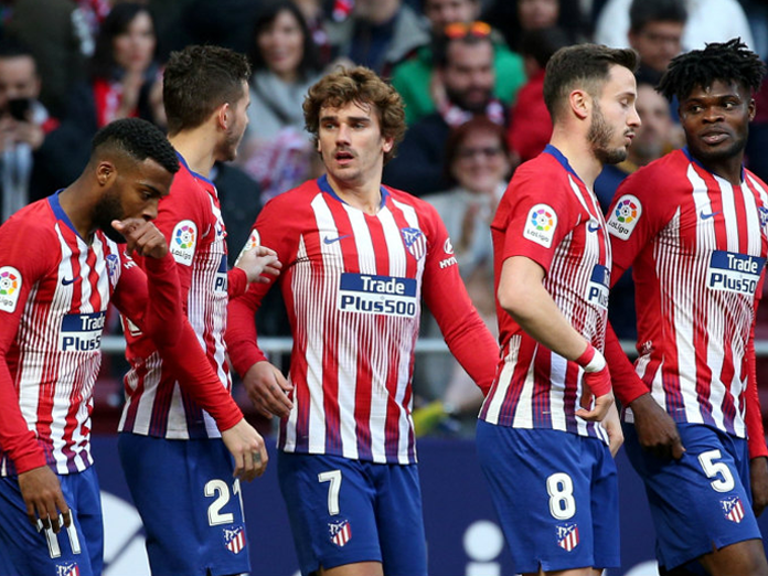 Griezmann, Niguez score as Atletico Madrid maintain pressure on Barcelona