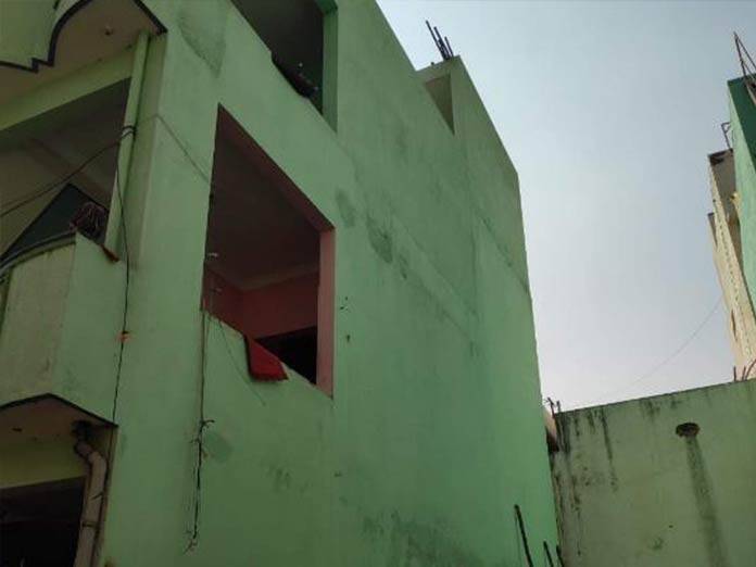 A three-storey building tilts as residents run to safety at Chamundi Nagar
