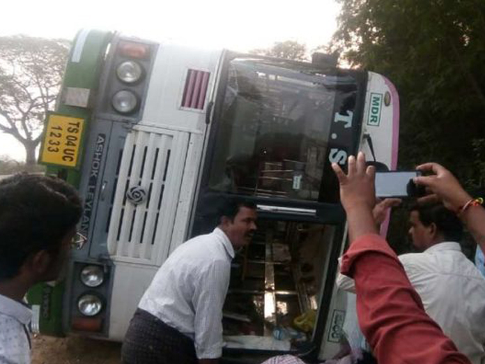 Narrow escape for passengers after RTC bus-lorry collide in Khammam