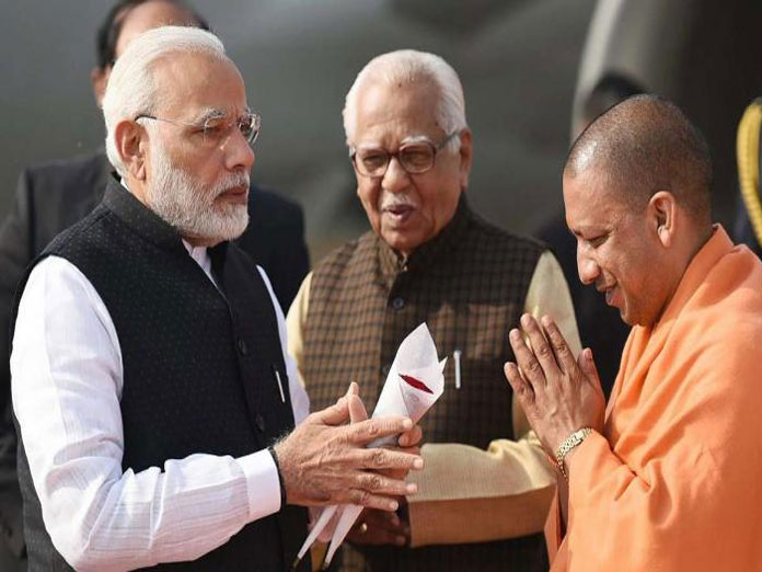 Hoardings with photos of Modi, Adityanath defaced in UP